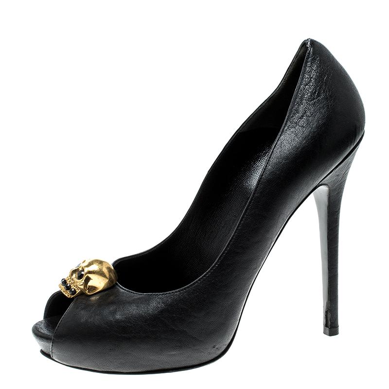 Make a bold style statement while flaunting this gorgeous pair by Alexander McQueen. Crafted with leather, they feature skull motifs above the peep toes and 13.5 cm heels for the right lift. The leather on the insoles will provides a soft feel to