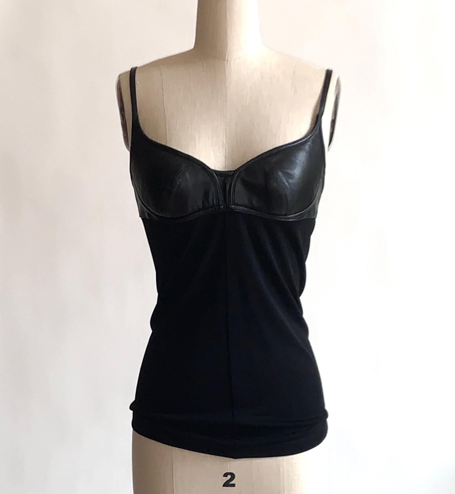 Alexander McQueen black tank with leather detailing at bust and leather straps. Center seams. Back zip and hook and eye. 

90% viscose, 10% leather.

Size IT 42, approximate US 4/6. See measurements.
Bust (underarm to underarm) 31
