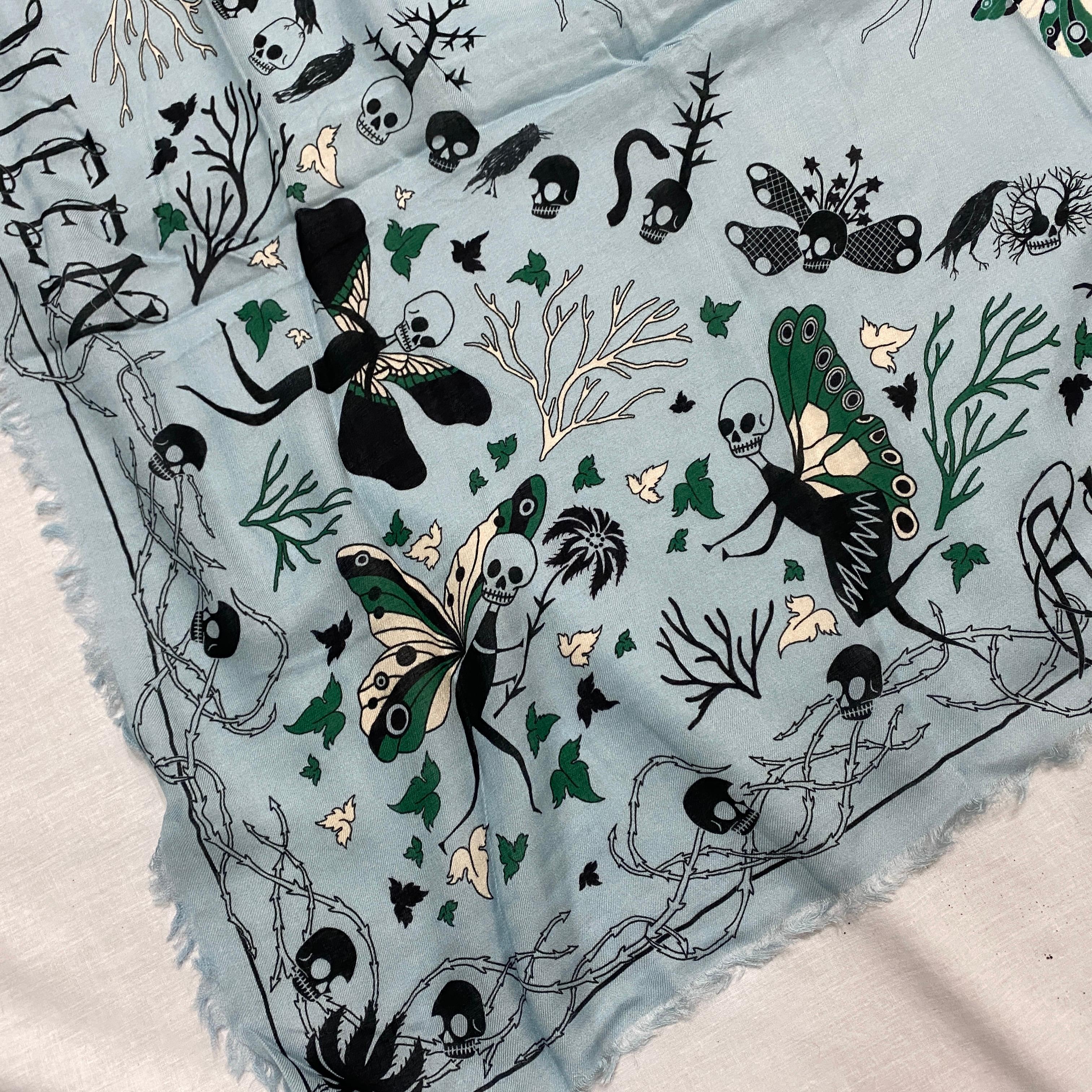 Alexander McQueen Light Blue Silk Foulard with Skulls and other iconic element of the stylist..
