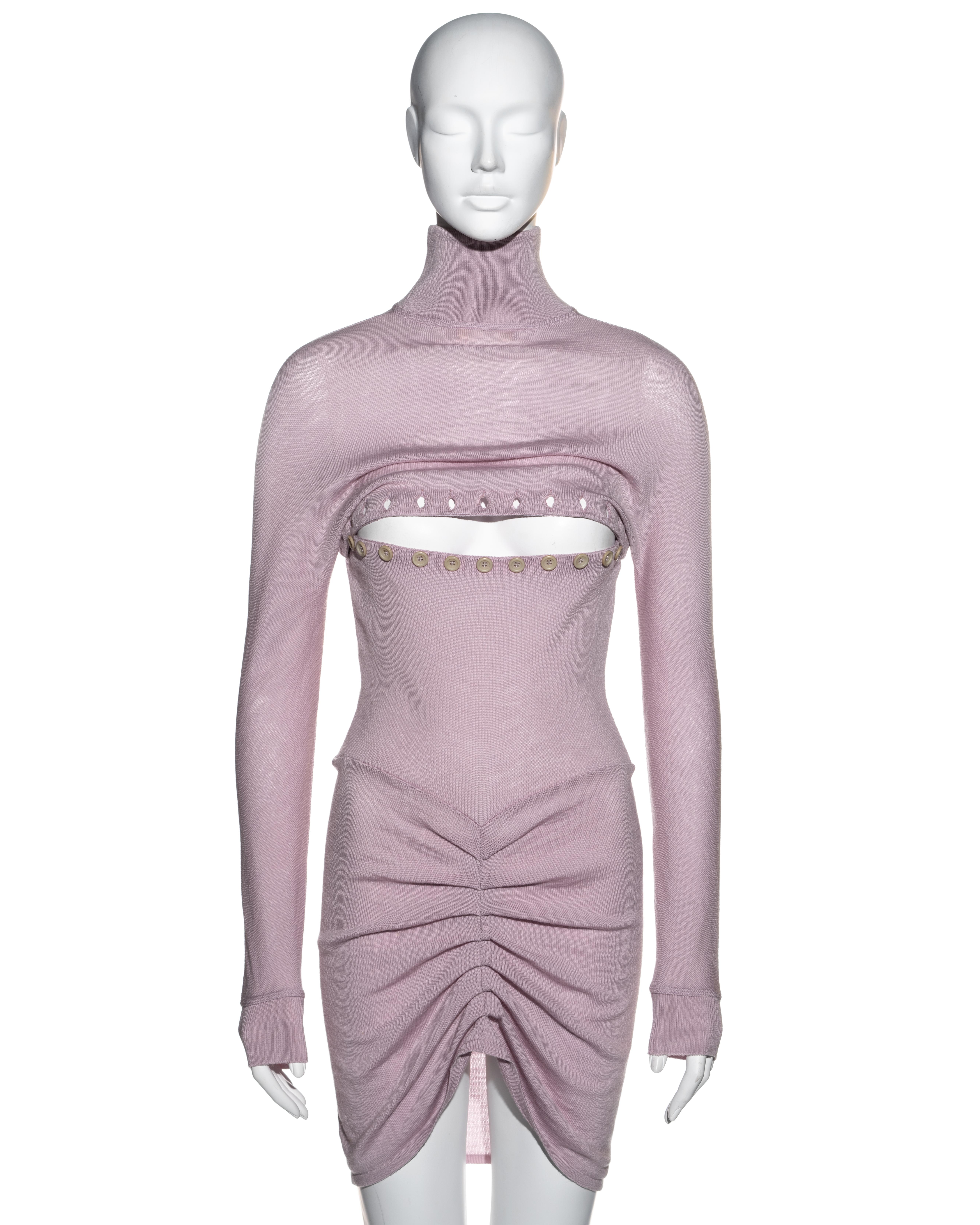 ▪ Alexander McQueen lilac wool sweater dress
▪ Turtleneck 
▪ Opening across bust line fastening with multiple buttons
▪ Pleated seam at centre-back 
▪ Worn back to front on the runway and in images 1 and 3
▪ Dante collection
▪ Size Medium
▪
