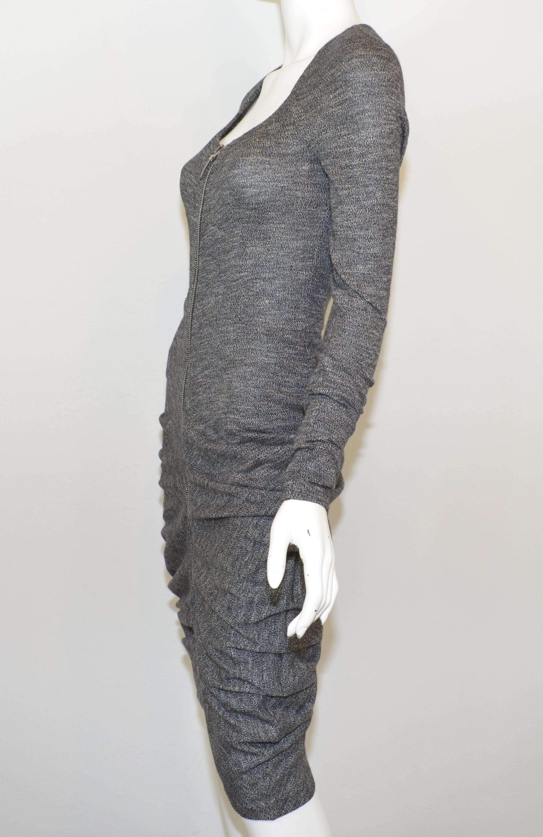 Alexander McQueen dress is featured in a gray, black, and white marled knit with a full zippered front closure and ruching along the bodice. Dress is a size 38. 

Measurements:
Bust 28”
Waist 27”
Hips 30” (some room for stretch)
Sleeves 31”