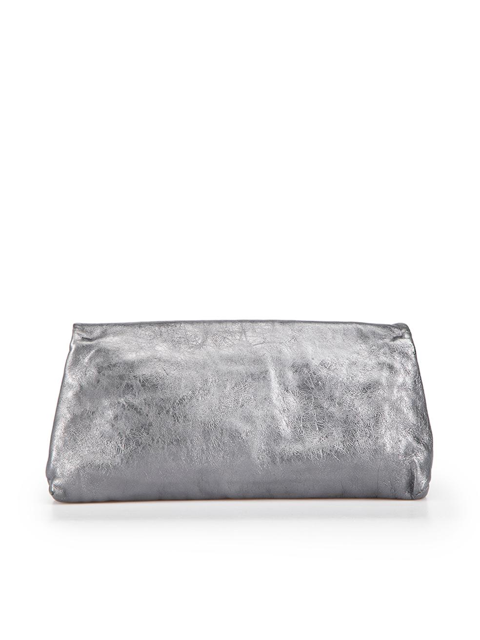 CONDITION is Good. Minor wear to bag is evident. Light wear to leather with abrasion to the surface finish seen near the edges on this used McQ designer resale item. Comes in original dust bag.

 Details
 McQ
 Metallic grey
 Leather
 Medium clutch
