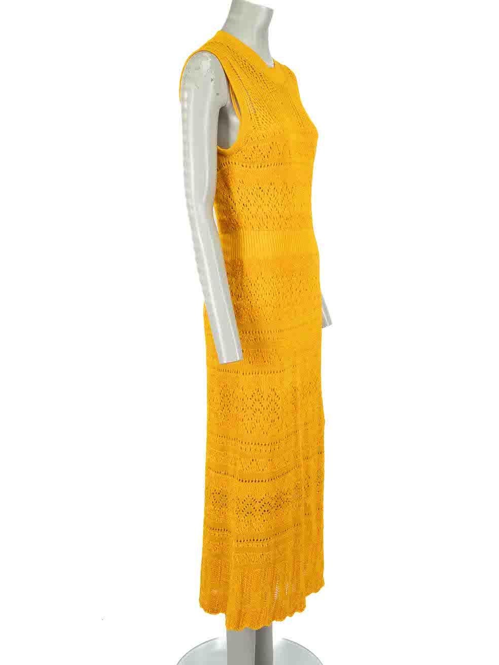 CONDITION is Very good. Minimal wear to dress is evident. Minimal loose thread to front left side of dress on this used McQ designer resale item.
 
Details
Mustard yellow
Wool
Knit dress
Sleeveless
Round neck
Midi
Slip under dress included
 
Made in