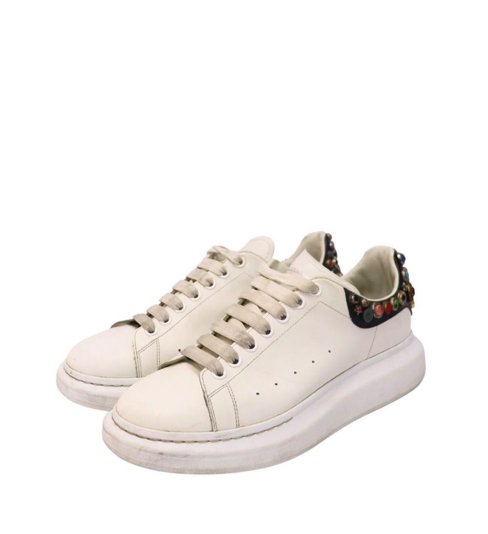 Alexander McQueen Men's Oversized White Sneakers, features a round-toe, lace-up style and a platform.

Material: Leather 
Size: EU 44
Overall Condition: Fair
Interior Condition: Signs of use
Exterior Condition: Stain, scuffing and marks