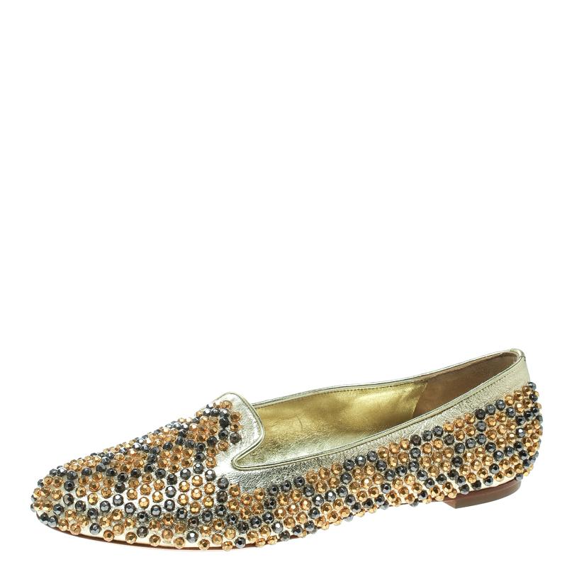 These slippers by Alexander McQueen are stylish and comfortable. Made from leather, they feature round toes and metallic studs all over. The insoles are leather lined for comfort and overall, the pair exudes a fashionable vibe.

Includes: Original