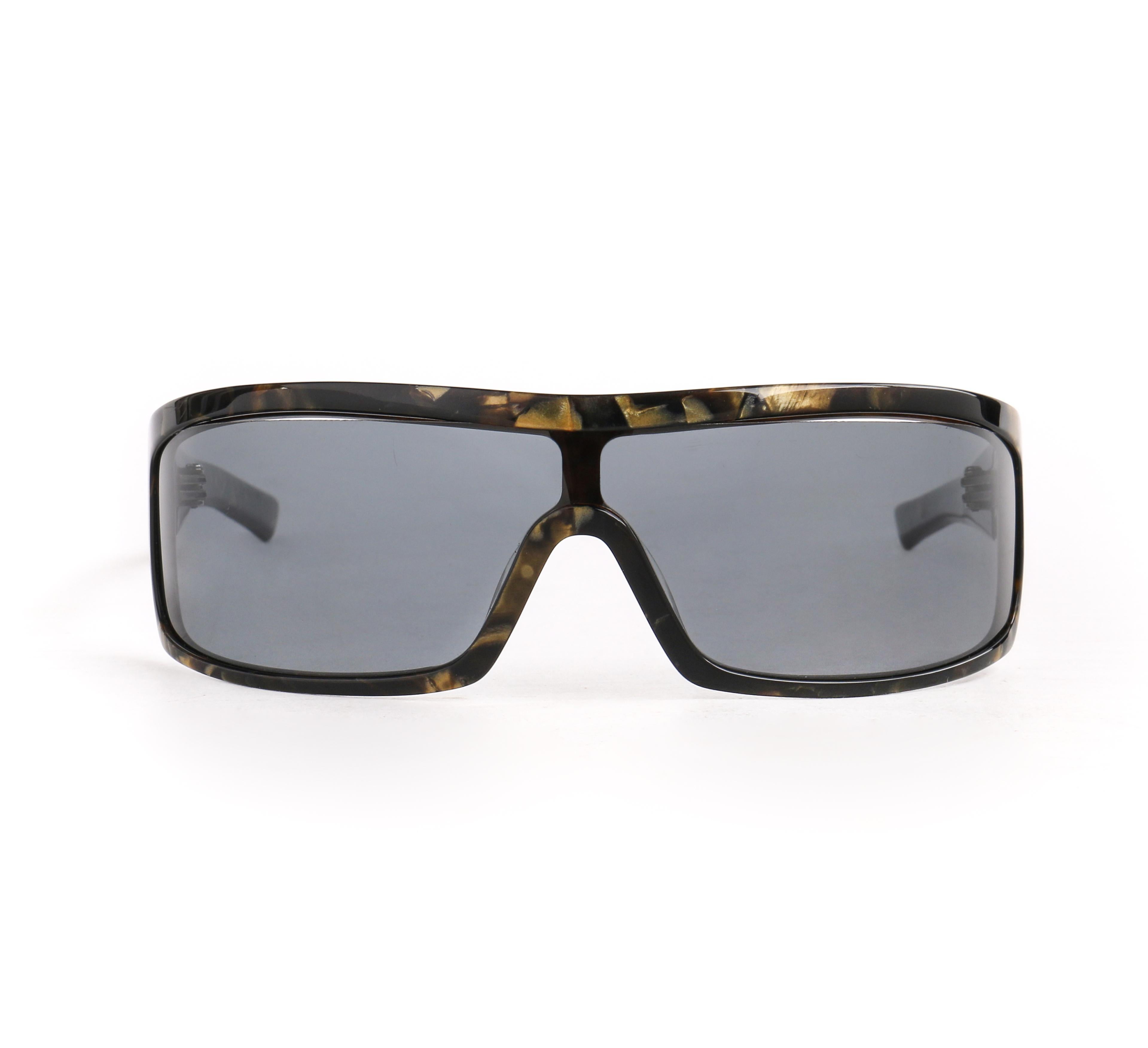 DESCRIPTION: ALEXANDER McQUEEN Metallic Gold Tortoise Shell Shield Sunglasses 4001/S
 
Brand / Manufacturer: Alexander McQueen
Style: Shield sunglasses
Color(s): Multi in shades of black and gold
Unmarked Material (feel of): Plastic
Additional