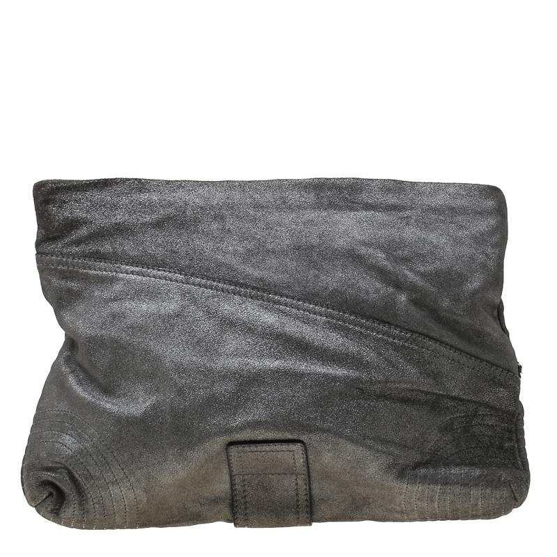 Made of textured leather, this metallic grey clutch from Alexander McQueen is a creation worthy of being yours. It is designed with zip details, a fabric interior, and a wristlet. The clutch is well-made and functional.

Includes: The Luxury Closet
