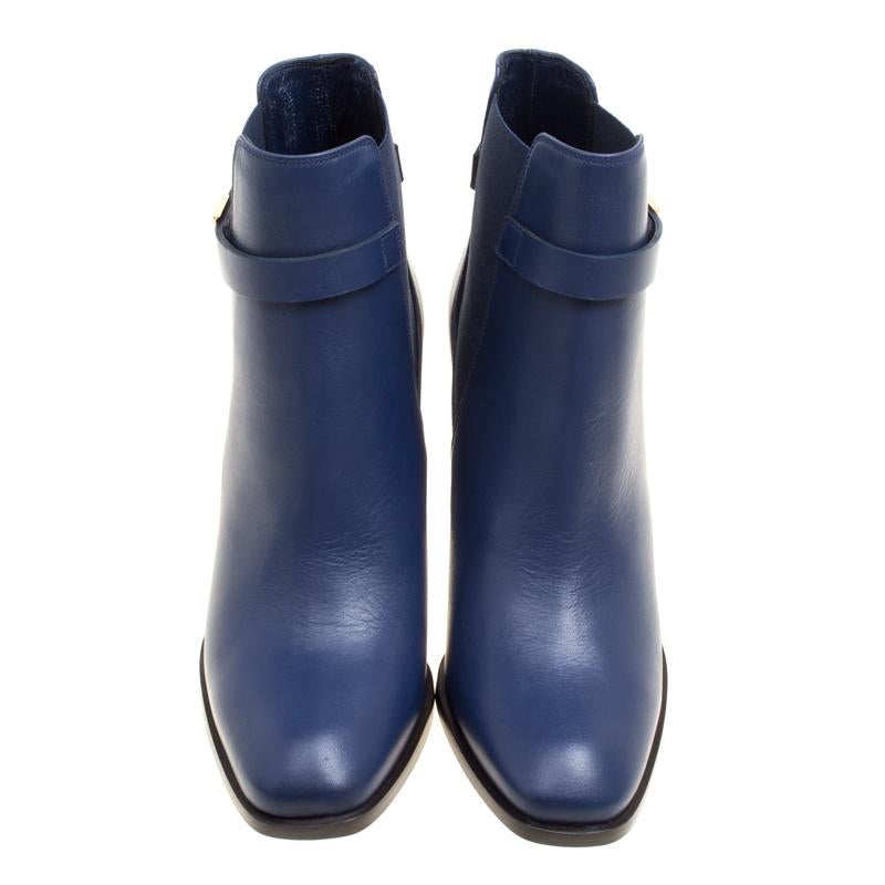 How can one not be in love with these ankle boots from Alexander McQueen! Crafted from midnight blue leather and fashioned to an ankle-length, these boots are on-point with style. They come with elastic panels on the sides, a belted trim rounding