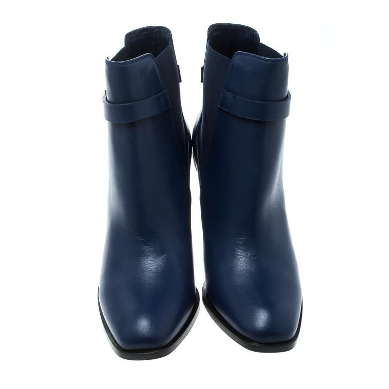 These ankle boots from Alexander McQueen are absolutely amazing! They are crafted from leather and elastic bands in a lovely midnight blue shade and feature square toes. They flaunt a gold-tone buckled strap and come equipped with comfortable