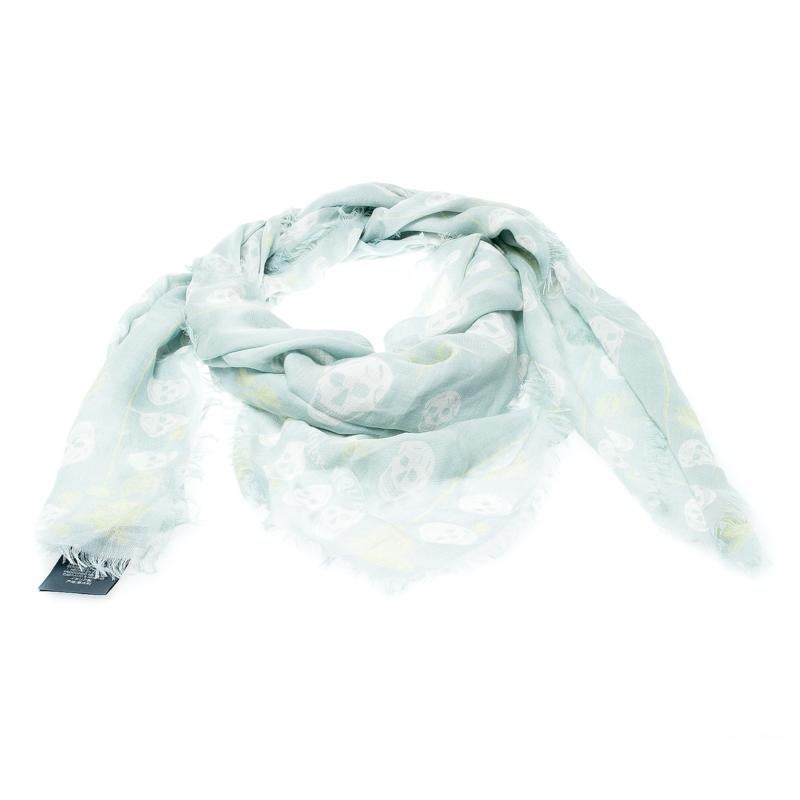 From the house of Alexander McQueen comes this edgy accessory that will highlight any outfit you choose. Created from quality fabrics, this scarf carries hemmed edges and signature skull prints with roses splayed over its expanse.

Includes: The