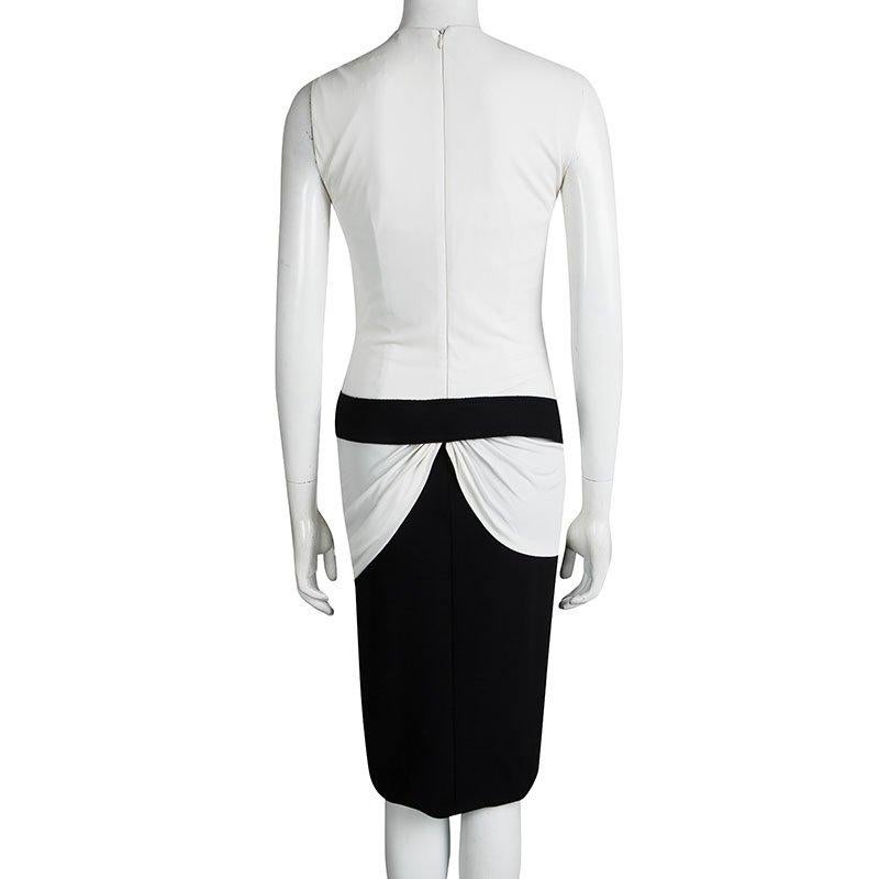 Dress up for an upcoming afternoon event in this Alexander McQueen's dress. This monochrome knit dress comes with draped detailing towards the waistline and a wide black band that separates the lower body from the upper. The figure-flattering