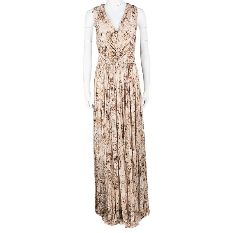 This maxi dress from Alexander McQueen is utterly gorgeous! It is styled as a sleeveless with ruched details, a back zipper and prints in multiple colours splayed all over. You can wear it with flats or high heels.

Includes: The Luxury Closet