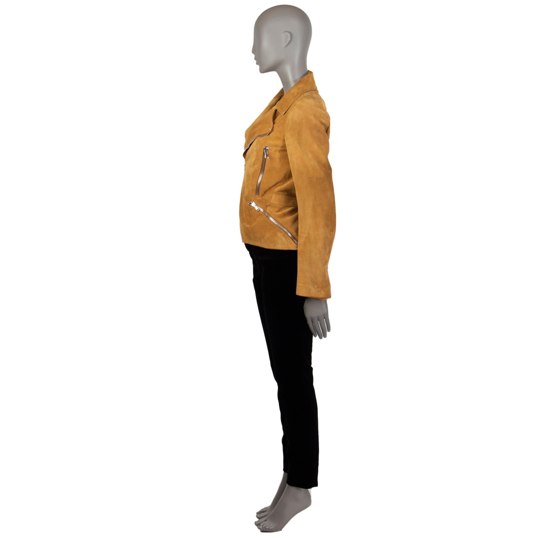 Alexander McQueen suede biker jacket in mustard suede with a notch collar and an attached belt on the back. Has two vertical and two asymmentrical pockets with a silver tone zipper on the front. Lined in silk (100%). There are some hardly noticeable
