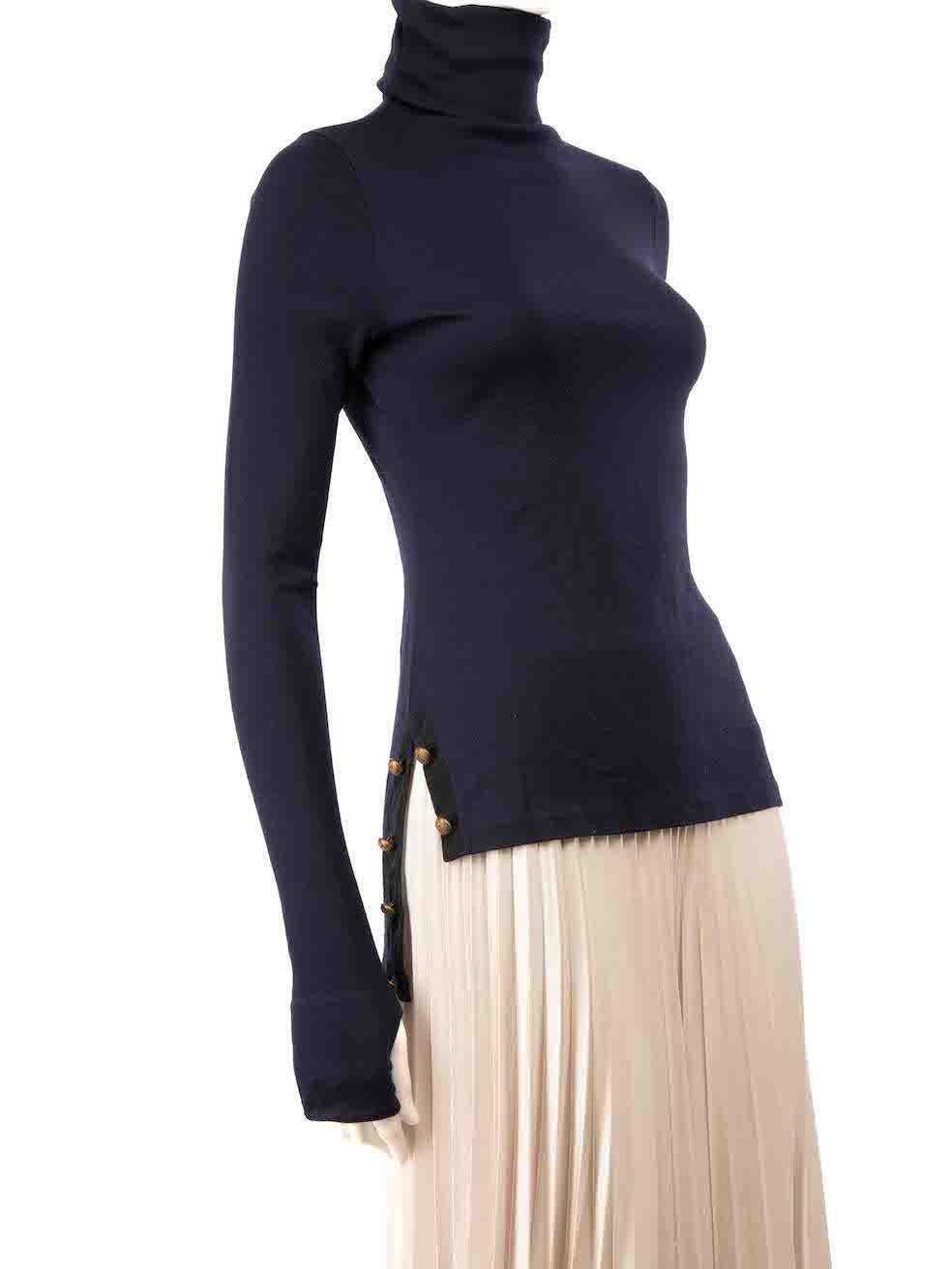 CONDITION is Very good. Minimal wear to top is evident. Overall pilling on this used Alexander McQueen designer resale item.
 
 
 
 Details
 
 
 Navy
 
 Wool
 
 Long sleeves top
 
 Stretchy
 
 Turtleneck
 
 Tumb hole on cuffs
 
 Button detail
 
 
 
