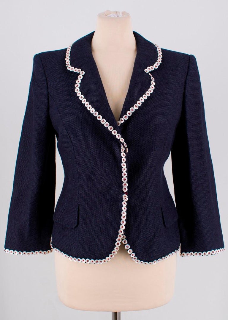 Alexander McQueen Navy Buttoned Jacket

- Navy in colour
- Rounded lapels
- 2 front pockets 
- 2 concealed popper closures
- Pearlescent buttons with red stitching round the rim, lapels and cuffs
- Shoulder pads
- Long sleeves
- Curved illusion