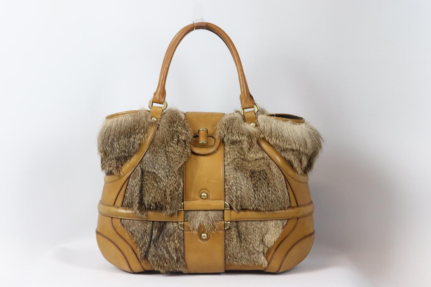 Alexander McQueen Novak fur and leather tote bag. Beige and brown. Twist lock fastening at front. Does not come with dusbtag or box. Height: 12 in. Width: 16 in. Depth: 5.75 in. Handle Drop: 5.5 in. Fair condition - Fur shedding slightly. Scuffs and