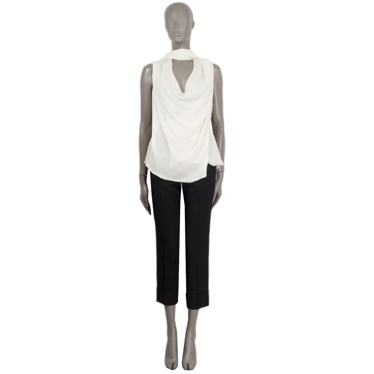 100% authentic Alexander McQueen draped sleeveless wrap blouse in off-white silk (100%). Comes with a attached scarf. Has been worn and is in excellent condition. 

Measurements
Tag Size	40
Size	S
Shoulder Width	36cm (14in)
Bust From	90cm