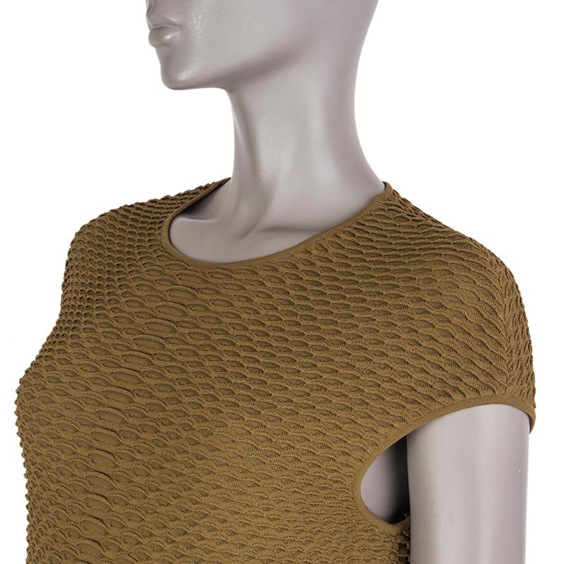 Alexander McQueen scalloped-knit dress in olive rayon (94%) and polyester (6%). With cap sleeves. Unlined. Has been worn and is in excellent condition. 

Tag Size L
Size L
Bust 86cm (33.5in) to 126cm (49.1in)
Waist 76cm (29.6in) to 106cm