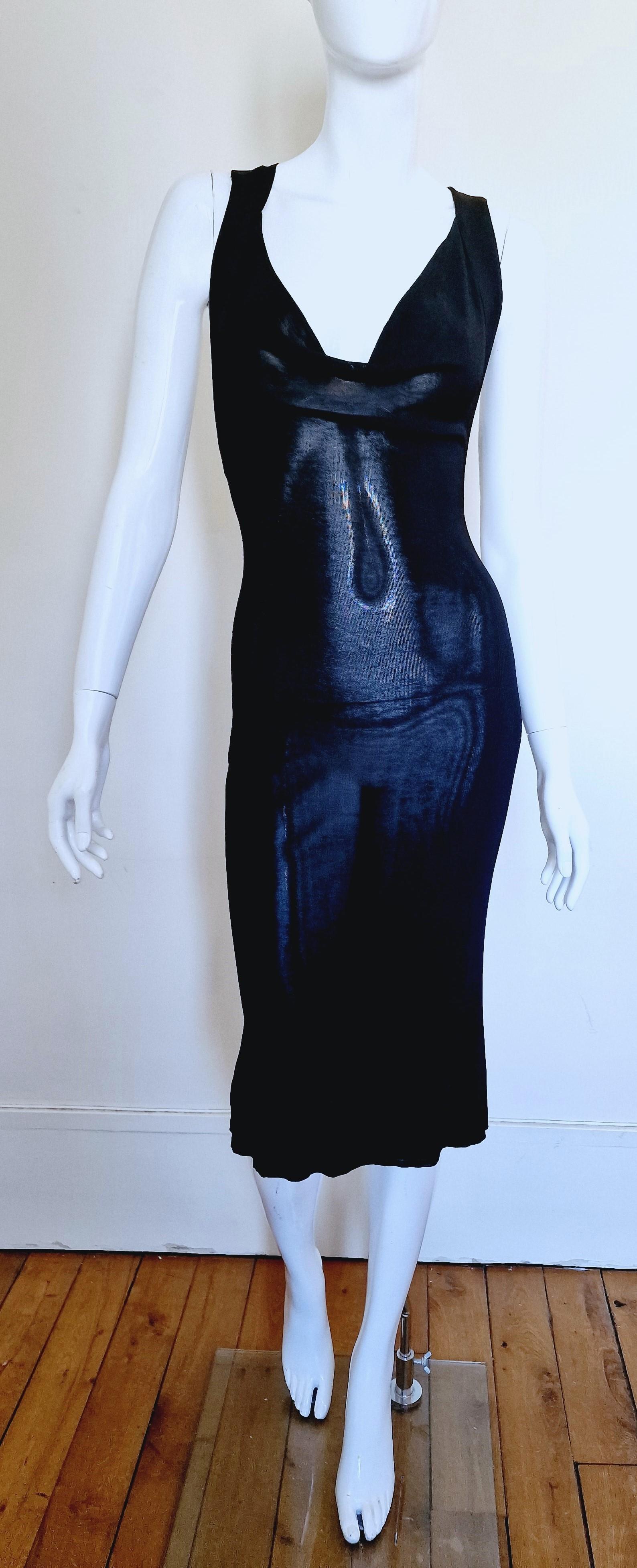 Bondage back dress by Alexander McQueen!
Wonderful silhouette.

EXCELLENT condition!

SIZE
Stretchy fabric!
Marked size: small.
It fits from small to medium.
Length: 109 cm / 42.9 inch
Bust: 34 cm / 13.4 inch
Waist: 27 cm / 10.6 inch
Hips: 40 cm /