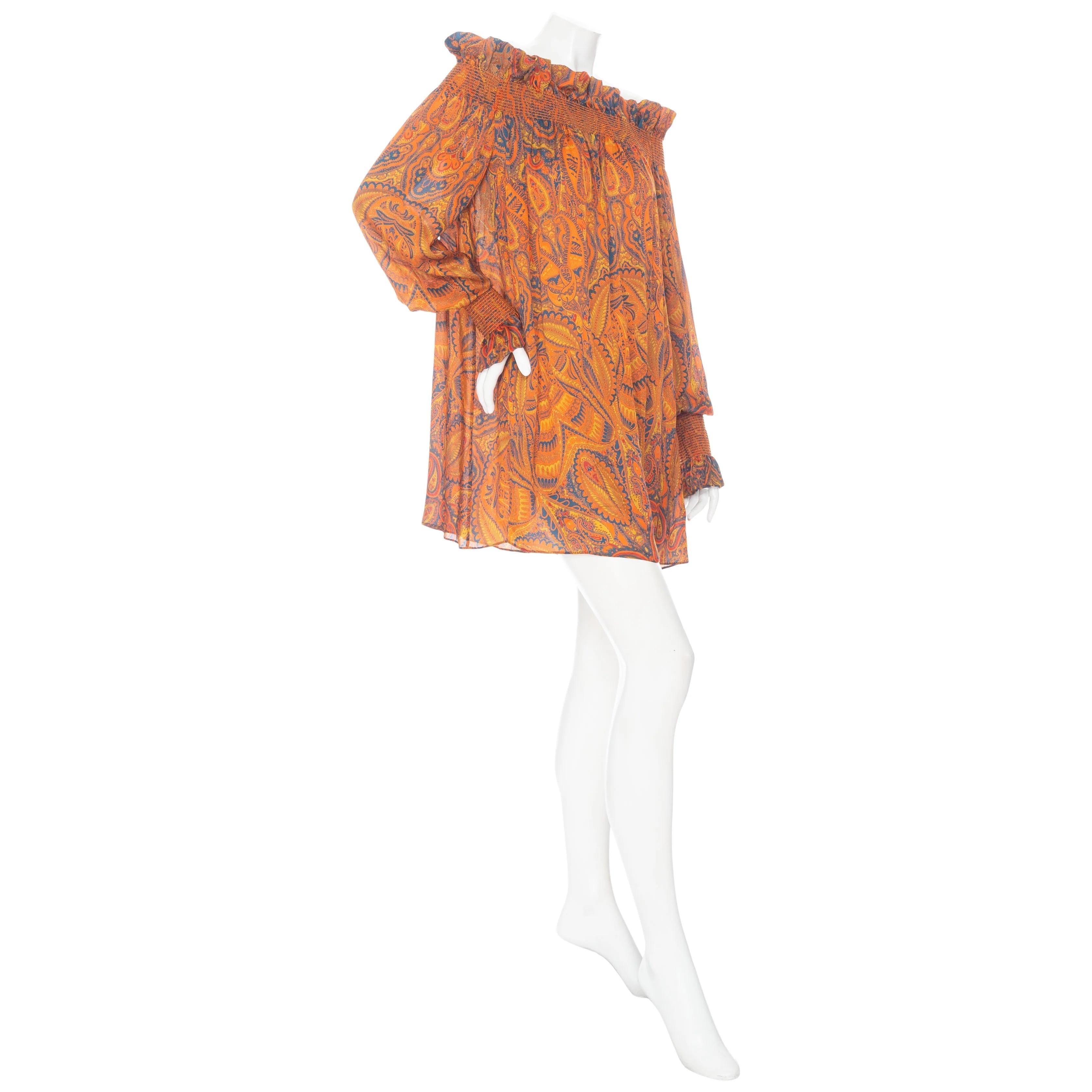 Alexander McQueen 2008 Orange Silk Off-the-Shoulder Multicolored Paisley Print Shift Dress 

Spring 2008 Ready-to-Wear
Multicolored paisley print on orange background
Smocked off-the-shoulder neckline with ruffled trim
Long bishop sleeves with