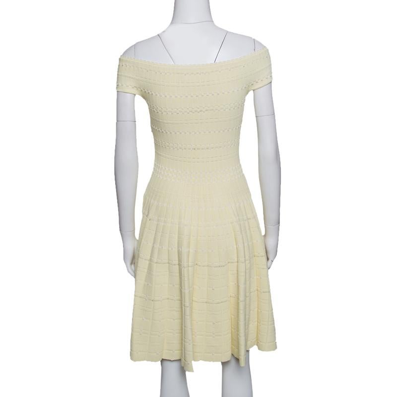 Wear this pretty Alexander McQueen dress and look like a diva yourself. This pastel yellow piece is the unparalleled way to stand out in a world full of generics. Crafted from a blend of fabrics, this elegant outfit is designed in a fit and flare