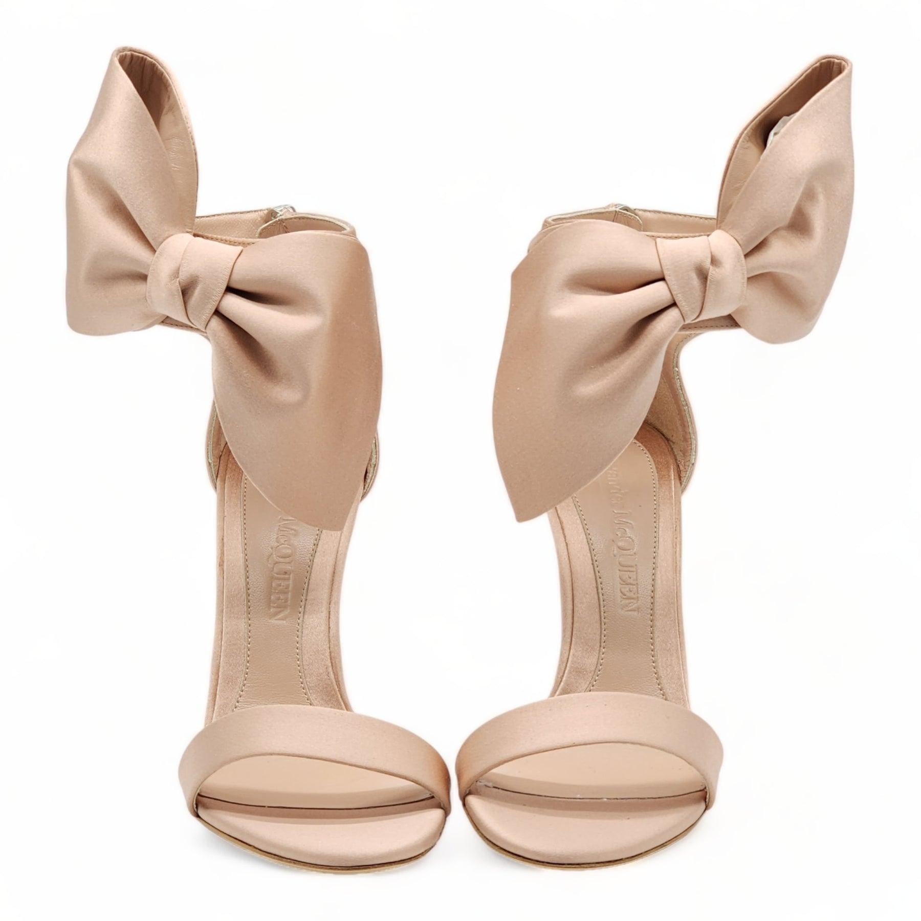The statement ‘Pin Heel’ sandals are part of the New Season collection from Alexander McQueen. This feminine style is crafted from premium satin with luxurious leather lining and sole Zip fastening to the back of the ankle creates an easy
