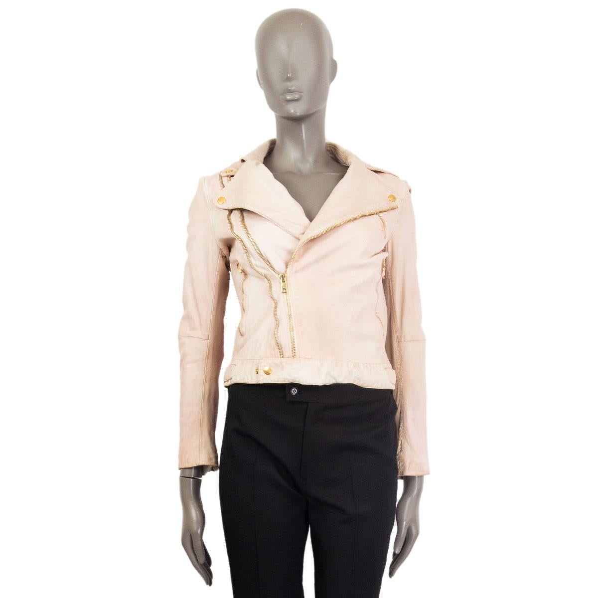 100% authentic Alexander McQueen biker jacket in pale rose distressed leather (100%) with notch collar, three zipper pockets on the front, belt loops around the waist, zippered cuffs. Collar can be held open with gold-tone snaps. Closes with