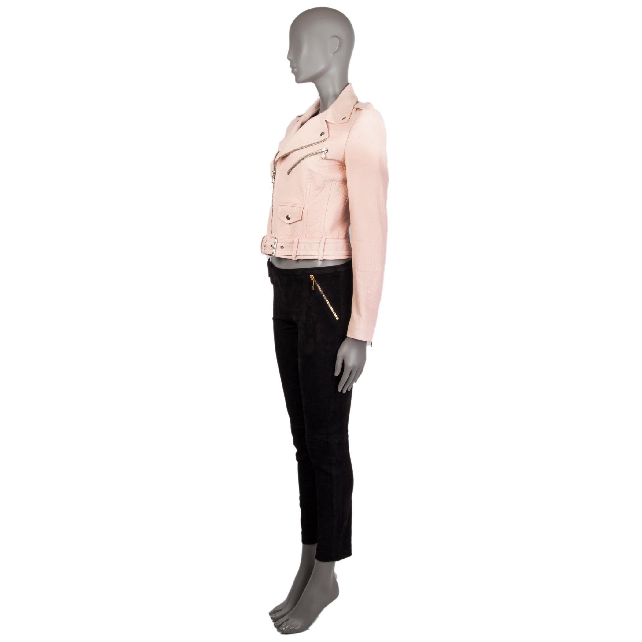Alexander McQueen cropped biker jacket in pale pink textured calf leather. With epaulettes, buttoned notch collar, zipper pocket on the chest, buttoned flap pocket on the front, belt loops and attached belt on the front of the hemline, cinching belt