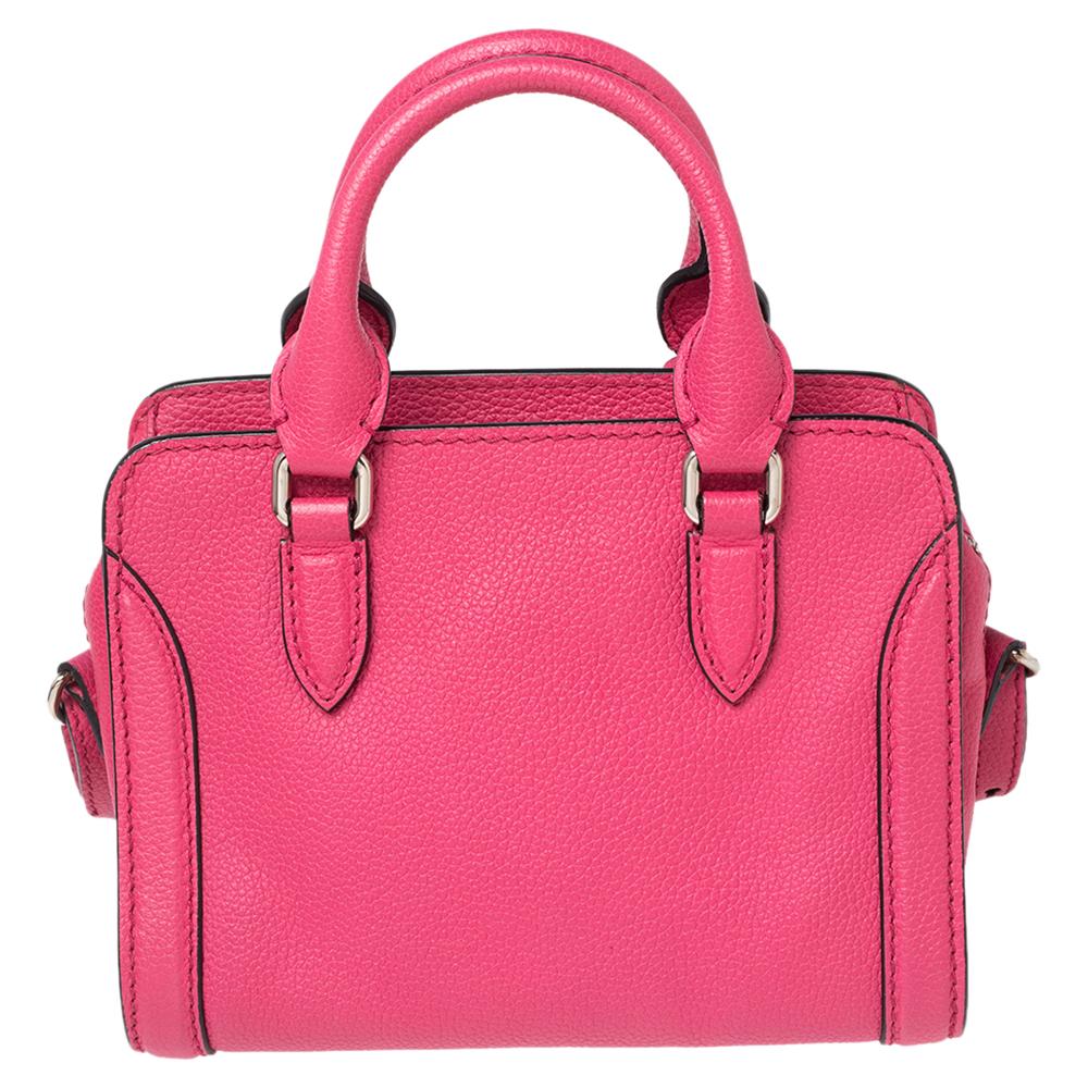 This tote by Alexander McQueen is made using pink leather. It features two handles, an adjustable shoulder strap, skull padlock detail, and a fabric interior secured by a top zipper.

Includes: Original Dustbag
