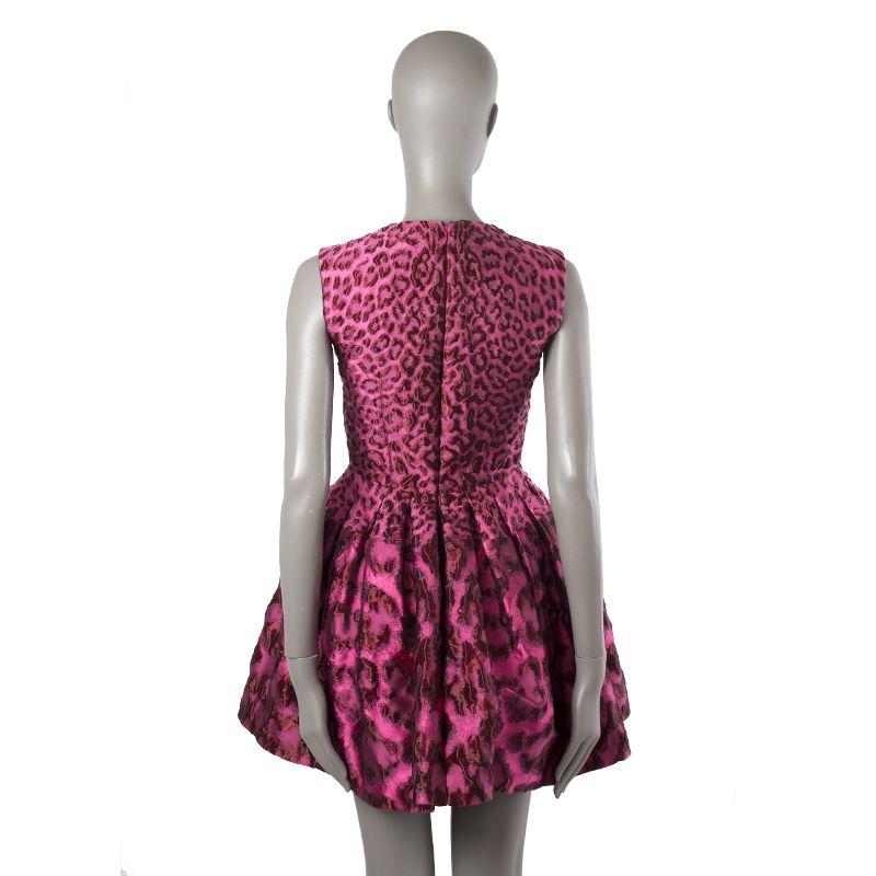 Alexander McQueen brocade leopard pouf dress in pink and red nylon (46%), silk (44%), and acrylic (10%). Closes with invisible back zipper. Lined in black rayon /75%) and silk (25%). Has been worn and is in excellent condition.

Tag Size 38
Size