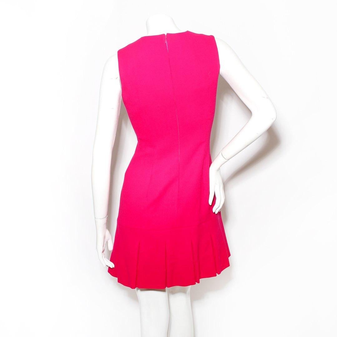 Mini dress by Alexander McQueen 
Fushia
Sleeveless 
Deep front v-cut
Pleated bottom
Pink-tone hardware
Lined
Made in Italy
Condition: Great, slight discoloration on underarm (see photos)
Size/Measurements: (approximate, taken flat)
Size 40
17.5