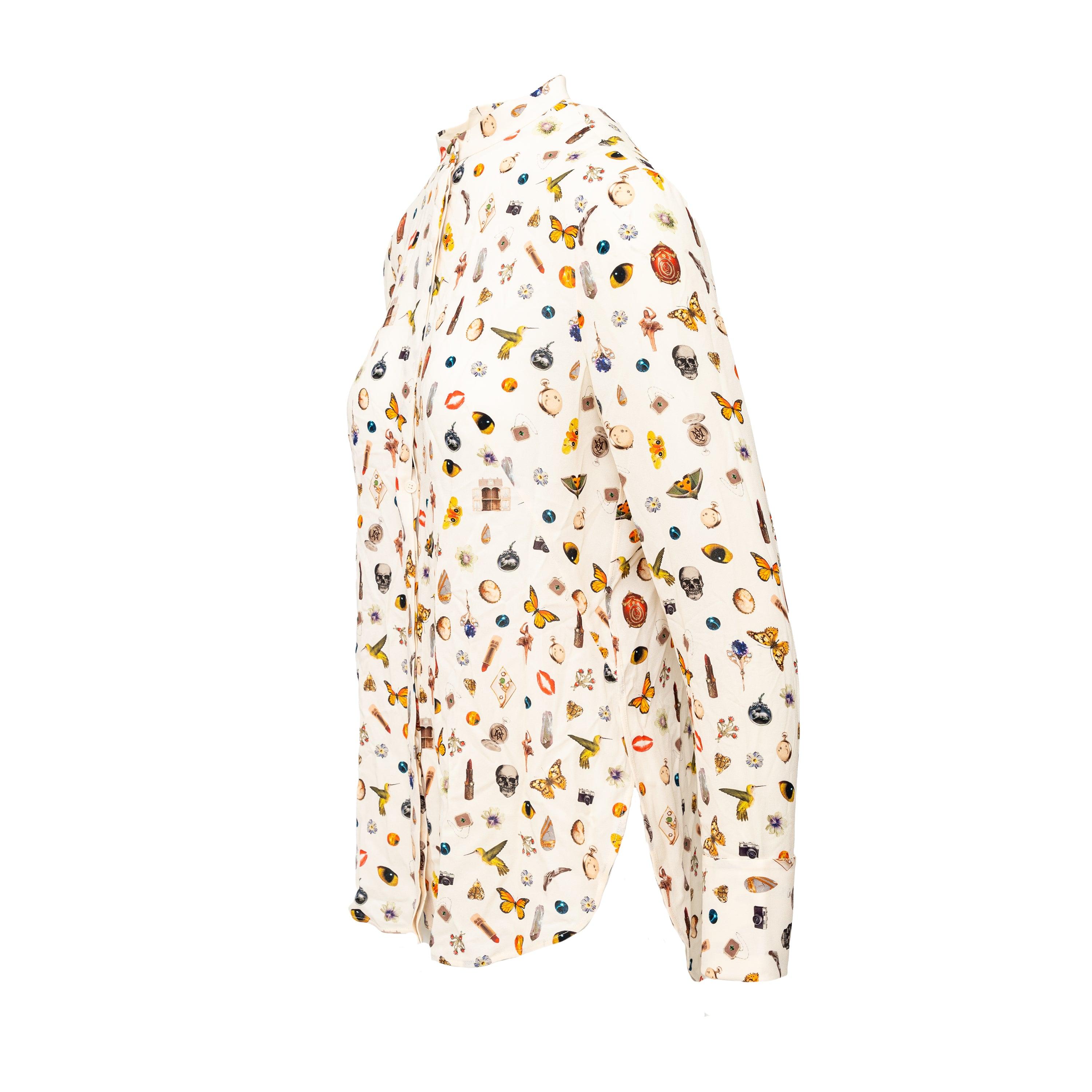 The Alexander McQueen Printed Silk Shirt from the Autumn Winter 2016 Collection, designed by Sarah Burton, features the iconic obsession print. Made from luxurious silk, this buttoned shirt boasts a modern round neck design. Elevate your wardrobe