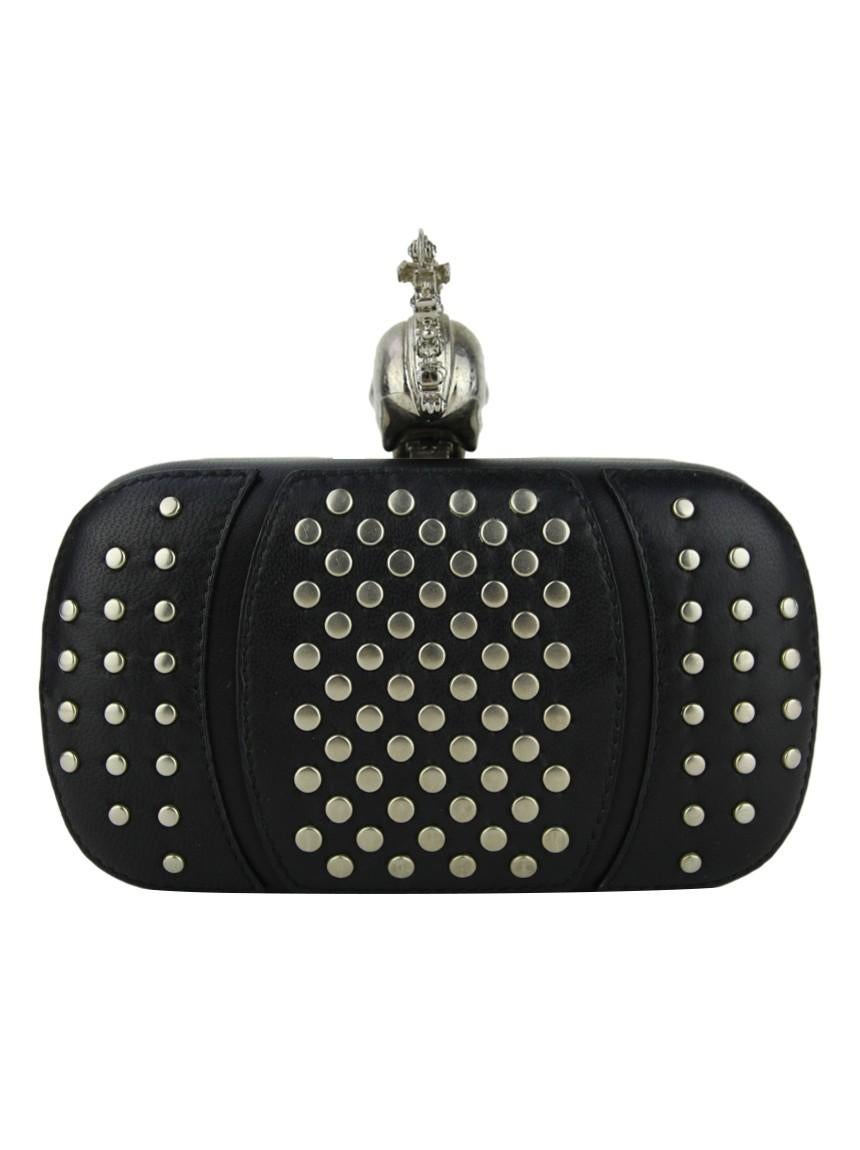 Alexander McQueen

Alexander McQueen Punk Skull Studded Leather Original Black Clutch. The structured rectangular model has a single compartment. Finished in studs, silver hardware, opening ends in hardware and clasp with skull fitting device with