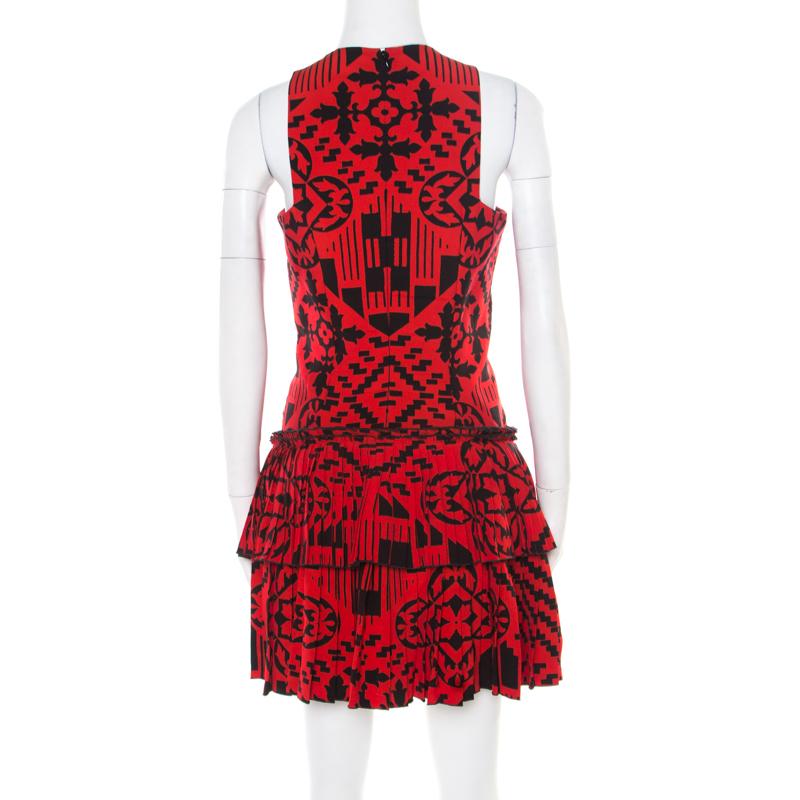This sleeveless dress from Alexander McQueen is just wonderful. The red and black tiered creation is made of a rayon and silk blend. It flaunts a square neckline and comes equipped with a concealed zip closure at the back. Pait it with stilettoes