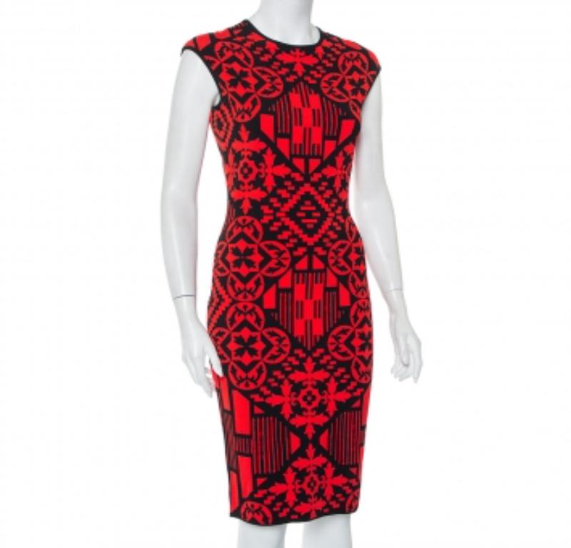 This Alexander McQueen dress will offer a statement look when paired with the right kind of accessories. The sheath dress in jacquard knit has shades of red and black, a knee-length hemline, and a great fit.