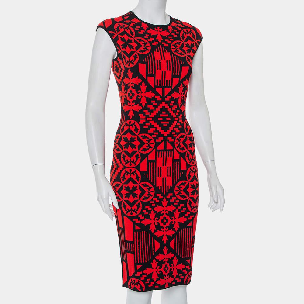This Alexander McQueen dress will offer a statement look when paired with the right kind of accessories. The sheath dress in jacquard knit has shades of red and black, a knee-length hemline, and a great fit.

