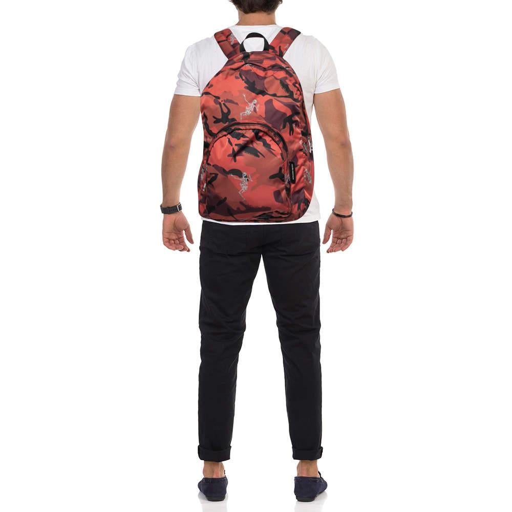 This Alexander McQueen bag will come in handy for daily use or as a style statement. It is crafted from camo nylon and designed with dancing skeletons and a spacious interior secured by a zipper. Two shoulder straps and a small top handle make it