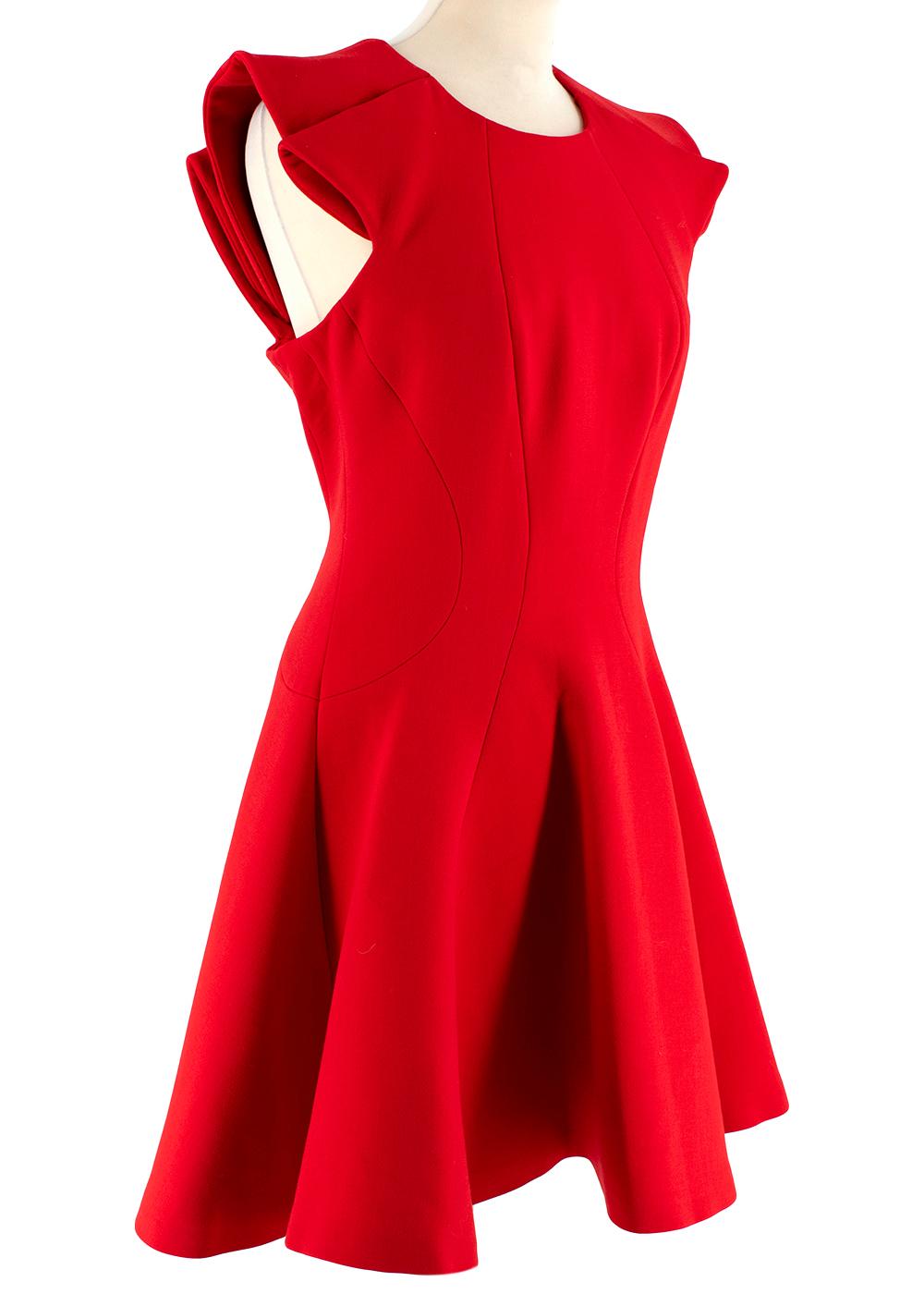 Alexander McQueen Red Fit and Flare Mini Dress

- Fit and flare skater dress
- Mid weight material
- Contour seams
- Rounded neck
- Rose petal inspired sleeves
- Hidden back zip
- Fully lined
- Slight stretch

Materials:
Poly blend
Silk lining

Made
