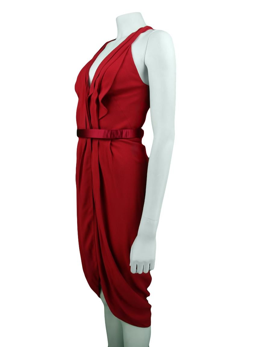 Alexander McQueen 

Original red Alexander McQueen halter dress.
 It has a waistline modeling, straight skirt with pleats and V-neckline.

 It has a draping detail on the bust, hooks and button on the neckline, front slit and swimmer model back.

