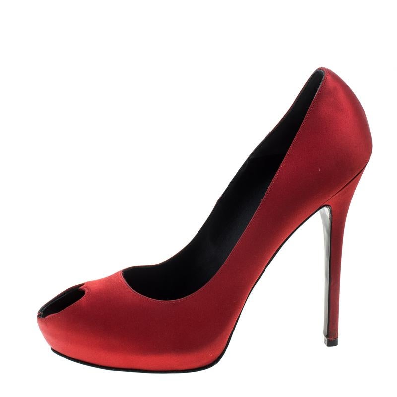 Mesmerizing and stylish, this pair of peep-toe pumps from Alexander McQueen is here to win your love. Perfectly crafted from satin, these pumps feature a red shade with heart-shaped peep toes, platforms and 13.5 cm heels.

Includes: The Luxury