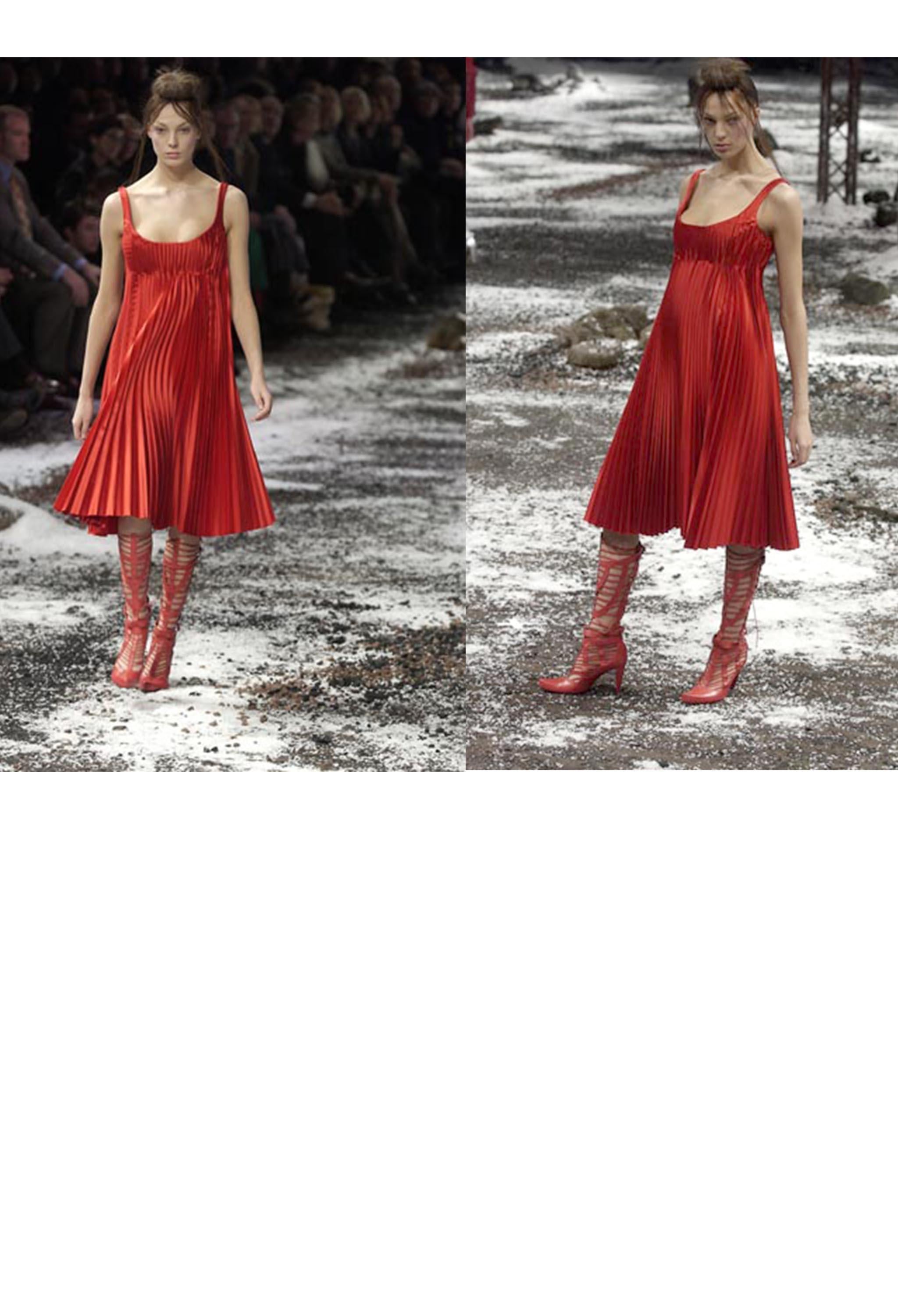 Resurrection Vintage is thrilled to present look #46 from Alexander McQueen's 2003 runway collection, Scanners. The dress boasts sharp knife pleats, an empire body, and an exposed portrait neckline, all perfectly cut in a luxurious heavy red satin.