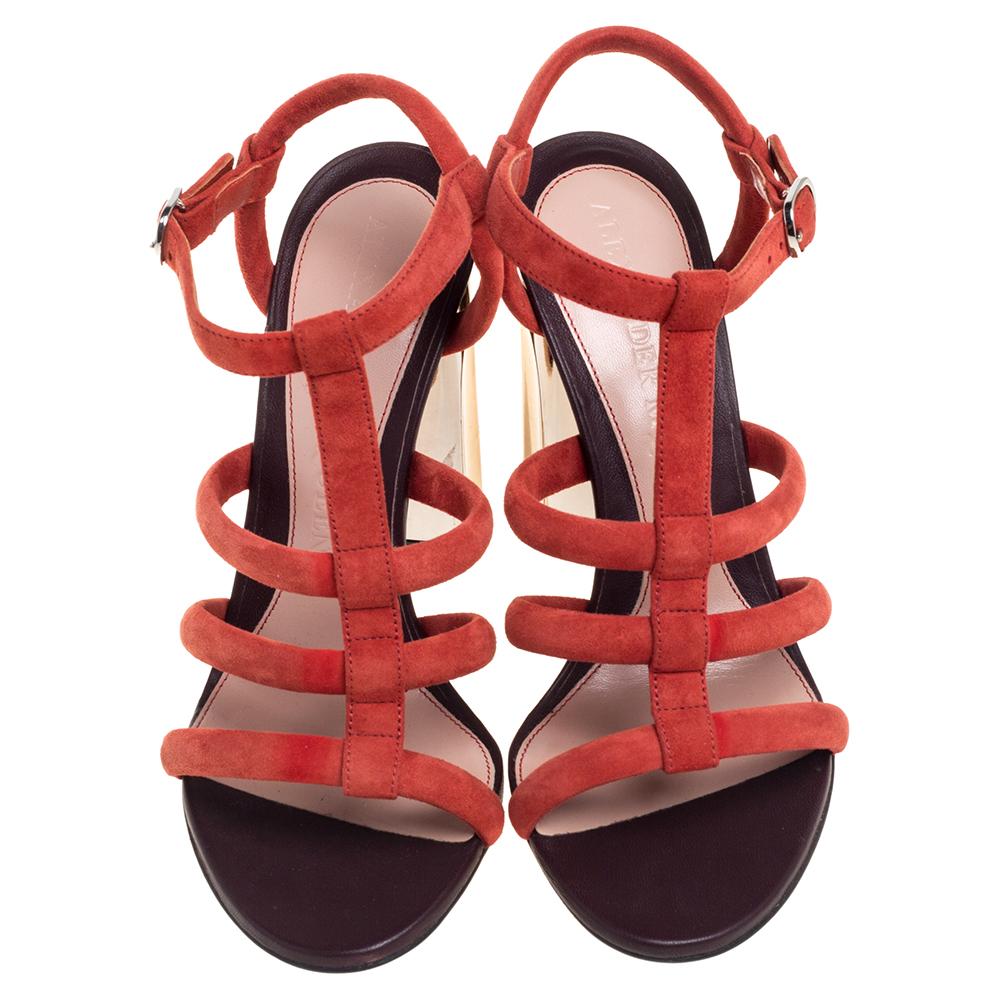 Designed to provide you with unparalleled comfort and style, these sandals from Alexander McQueen are sure to make a valuable addition to your wardrobe! The red sandals are crafted from suede in an open-toe strappy silhouette and exhibit ankle