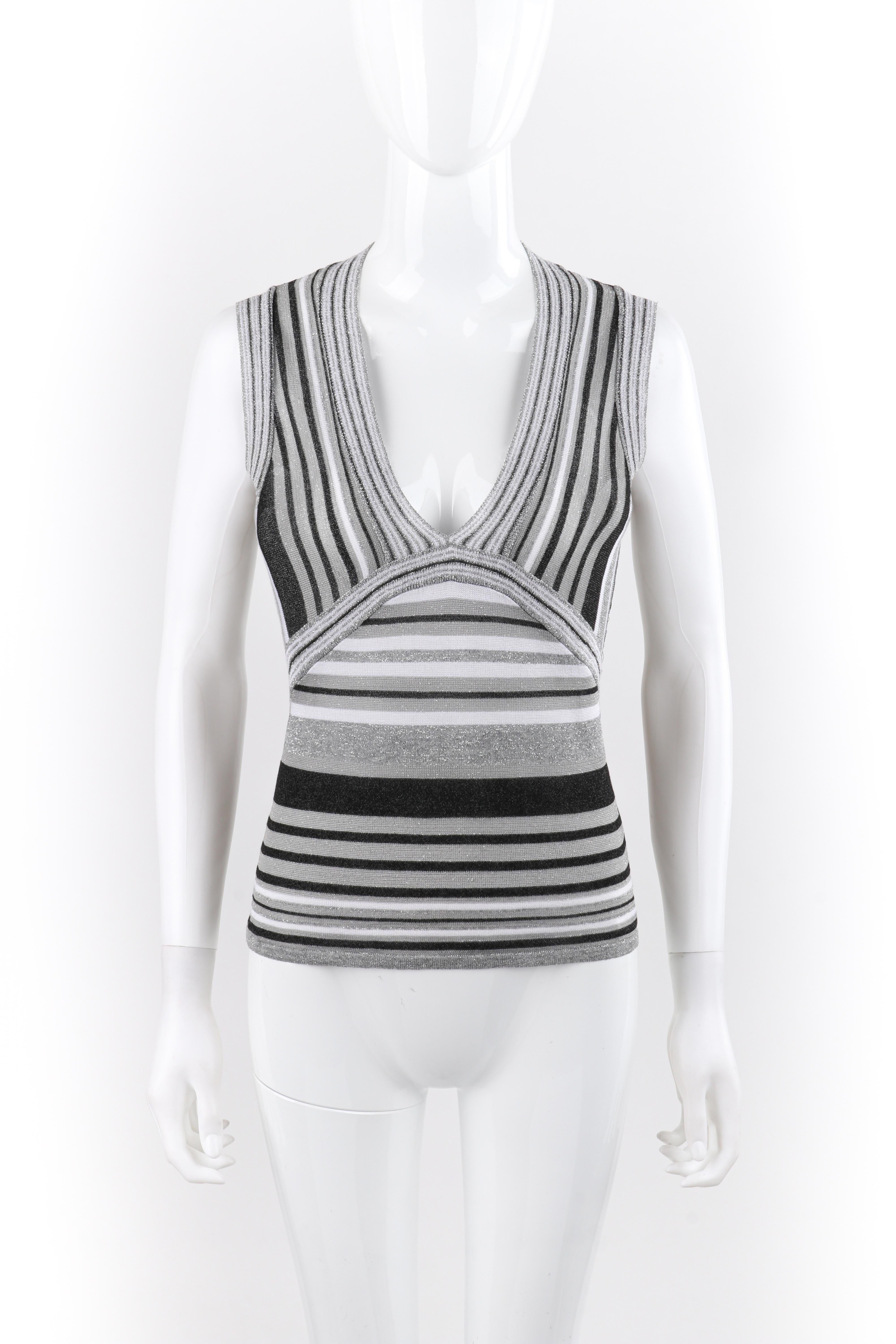 ALEXANDER McQUEEN S/S 1996 “The Hunger” Metallic Striped V-Neck Knit Tank Top
 
Brand / Manufacturer: Alexander McQueen 
Collection: S/S 1996 “The Hunger”
Designer: Alexander McQueen
Style: Sleeveless knit top
Color(s): Shades of silver, gray,