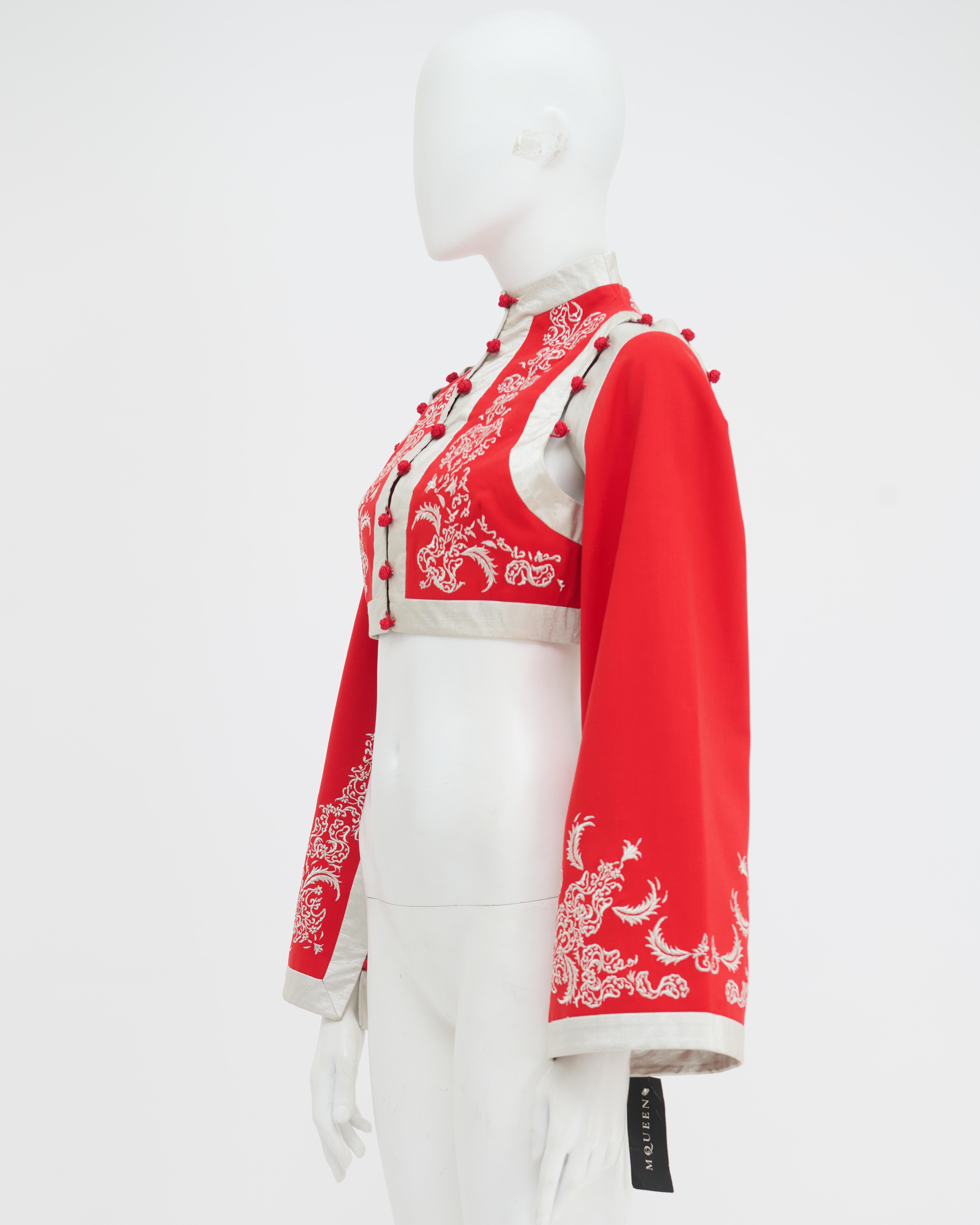 - Designed by Alexander McQueen
- Sold by Skof.Archive
- Spring Summer 2000 “Eye” Collection
- Silk Red Kimono Bolero
- Cropped Fit
- Floreal Pattern 
- Button Up Closure 
- Button Details on the sleeves 
- Bell Sleeves
- High Neck
- Made in Italy
-