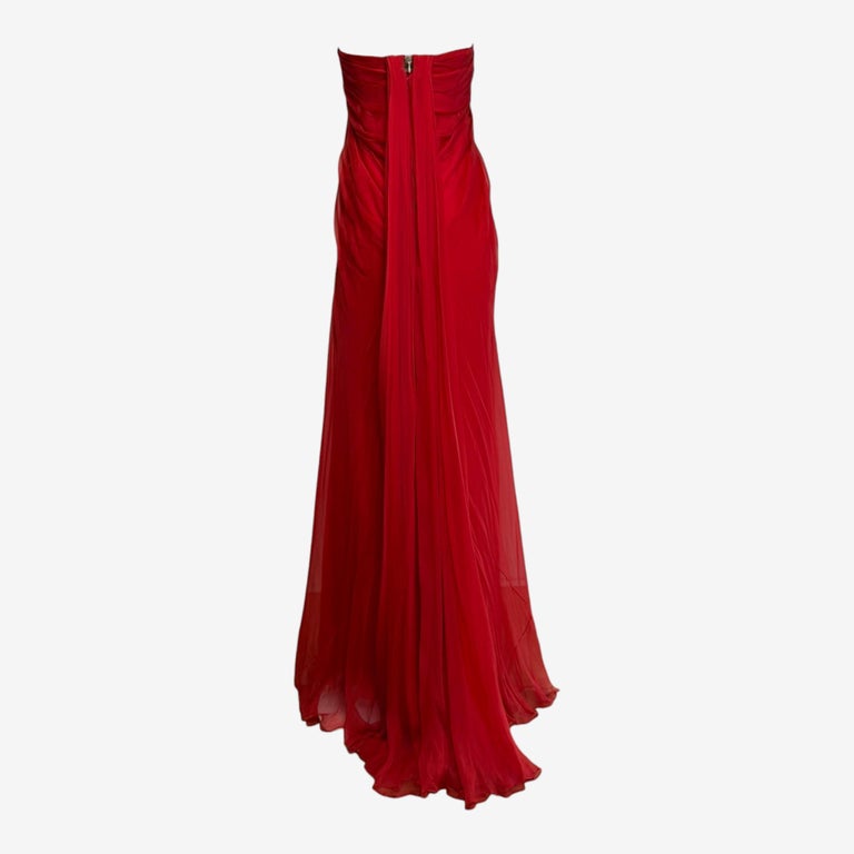 alexander mcqueen red pleated dress A carnelian red fluid silk satin draped dress with pleated sleeves and an open back. Discover the #McQueenPreAW20 collection via the link in our bio. Photographed by @_AdamaJalloh. #AlexanderMcQueen