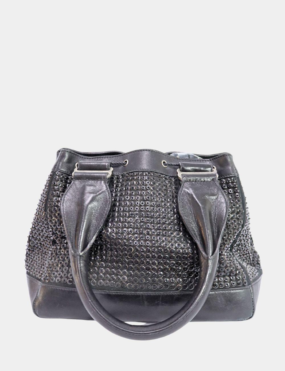 Sac à main à paillettes Alexander McQueen, avec deux anses et une tête de mort signature.  charme, deux poches extérieures et une poche intérieure.

MATERIAL : Cuir
Matériel : Argent
Hauteur : 21cm
Largeur : 26cm
Profondeur : 20cm
Longueur de l'anse