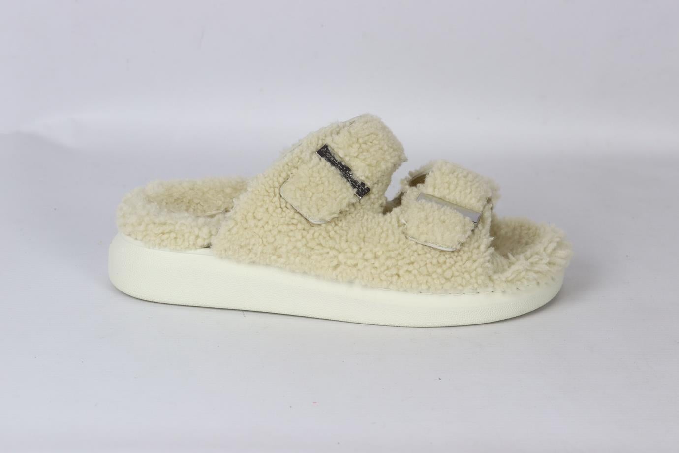 Alexander McQueen shearling platform slides. Cream. Slip on. Does not come with dustbag or box. Insole: 10.5 in. Platform: 2 in. Very good condition - Light wear to soles; see pictures