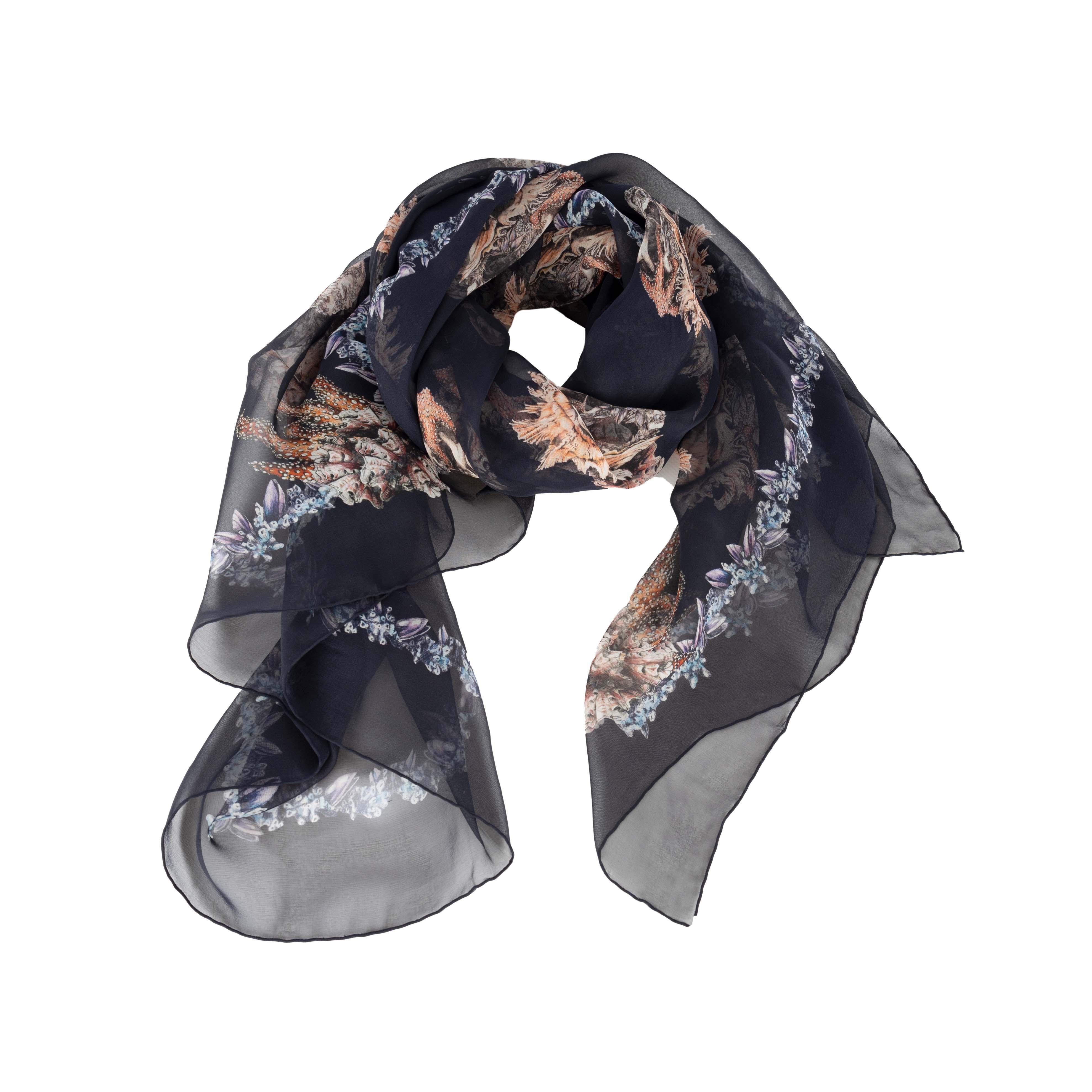 Alexander McQueen sheer silk scarf adorned with the brand's iconic skull motif and sea creature print. The scarf perfectly combines luxe fashion with gothic symbolism and is sure to add a rebellious edge to any outfit.