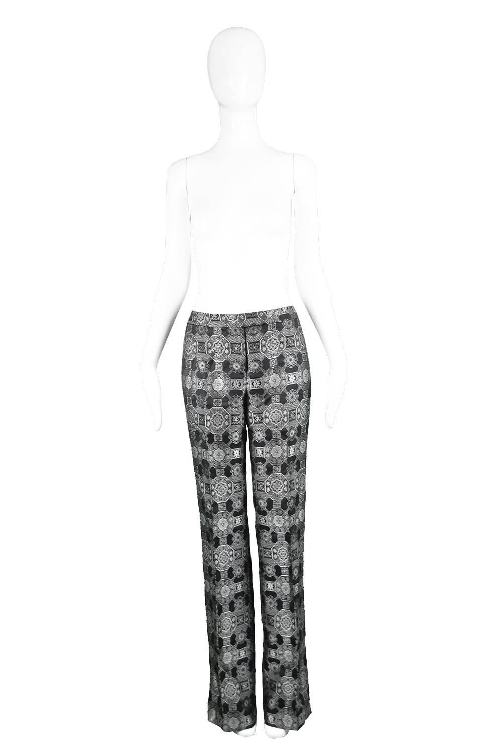 Alexander Mcqueen Black & Silver Metallic Brocade Pants, A/W 2003

Estimated Modern Size: UK 12-14/ US 8-10/ EU 40-42. Would suit a taller woman with heels due to long leg but could always be taken up by a seamstress. Please check measurements.
Low