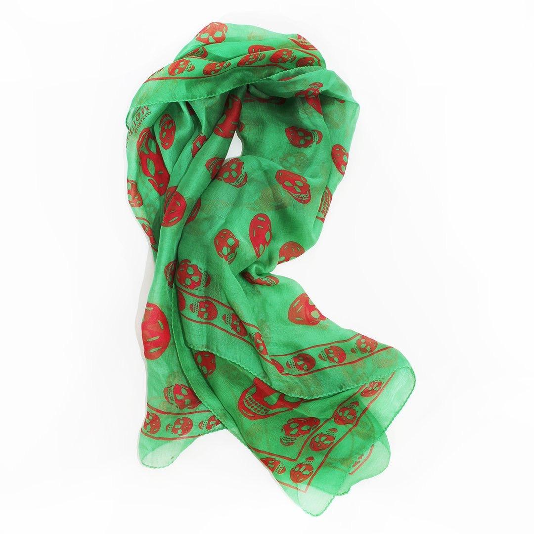 Skull scarf by Alexander McQueen 
Green silk 
Red skull pattern
100% silk 
Made in Italy 
Condition: Good, a couple small black marks, small hole at corner (see photos)
Size/Measurements 
One size fits all 
40